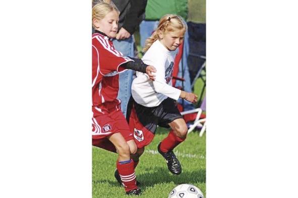 Riley disputando un partido en una liga infantil de Grand Rapids, Michigan, Estados Unidos.