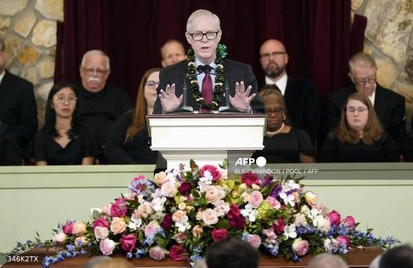 Jack Carter, son of former US President Jimmy Carter, speaks during a funeral service for former US First Lady Rosalynn Carter, at Maranatha Baptist Church in Plains, Georgia, on November 29, 2023. - Former US first lady Rosalynn Carter, who died last week at the age of 96, will be buried at her home in Georgia later on November 29, 2023, following a private funeral service attended by her ailing husband Jimmy Carter. The burial comes after a public ceremony on November 28, 2023, in Atlanta where President Joe Biden and former president Bill Clinton, as well as all five living first ladies, paid their final respects. (Photo by Alex Brandon / POOL / AFP)