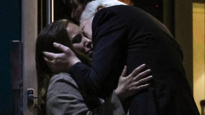 WikiLeaks founder Julian Assange (R) kisses his wife Stella Assange (L) after arriving at Canberra Airport in Canberra on June 26, 2024, after he pleaded guilty at a US court in Saipan to a single count of conspiracy to obtain and disseminate US national defence information. - WikiLeaks founder Julian Assange returned home to Australia to start life as a free man June 26 after admitting he revealed US defence secrets in a deal that unlocked the door to his London prison cell.