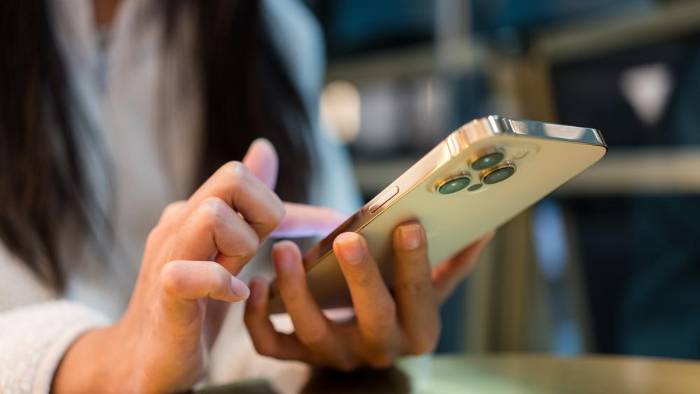 Woman use of mobile phone in cafe